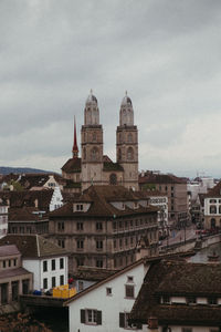 Buildings in town against sky