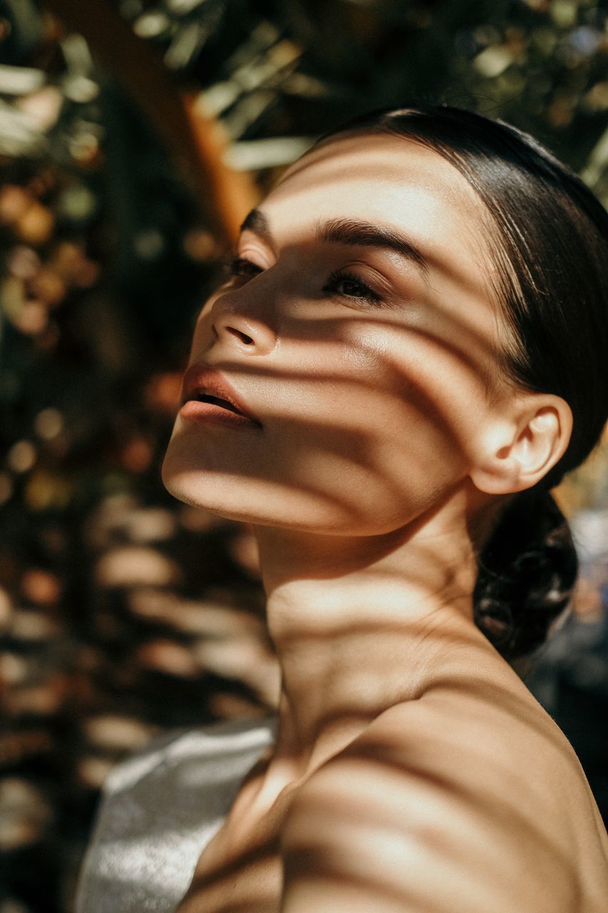 adult, portrait, one person, women, headshot, young adult, human face, female, nature, person, close-up, tree, looking, fashion, hairstyle, human head, smiling, brown hair, outdoors, photo shoot, plant, lifestyles, happiness, portrait photography, emotion, elegance, eyes closed, human hair