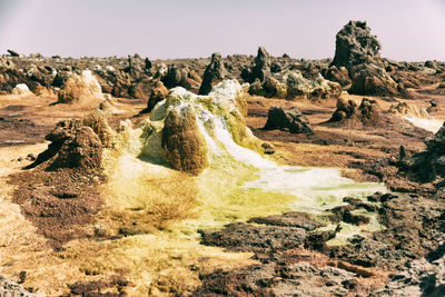 Scenic view of rock formations against sky