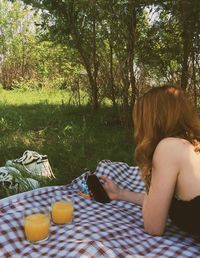 Woman sitting on table