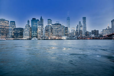 City skyline against blue sky