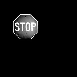 Close-up of sign on black background