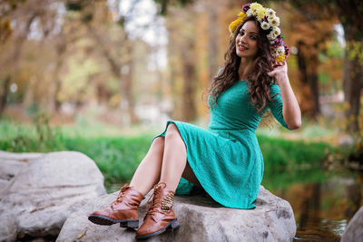 Portrait of a young woman sitting outdoors