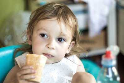 Portrait of cute boy eating food