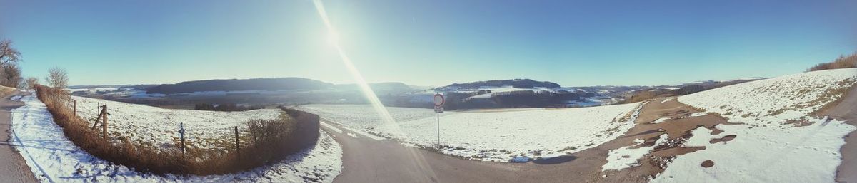 Panoramic view of landscape against clear sky during winter