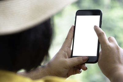 Close-up of hand using mobile phone