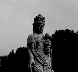 Low angle view of statue against sky