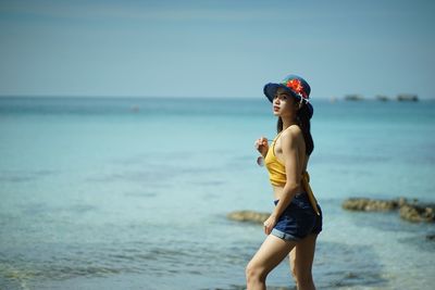 Full length of man standing on beach