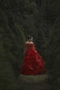 Rear view of woman with red umbrella