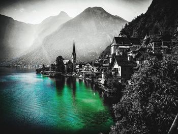 Panoramic view of river and buildings against sky