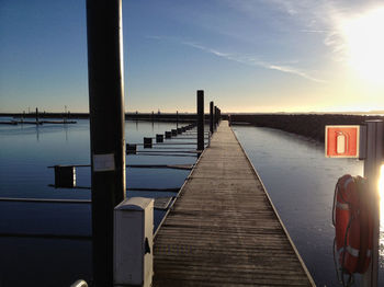 Pier over sea against sky