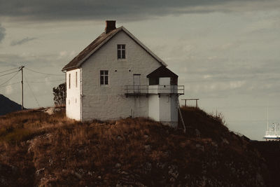 House on field against sky