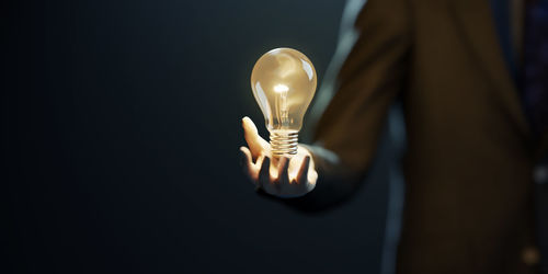 Close-up of illuminated light bulb