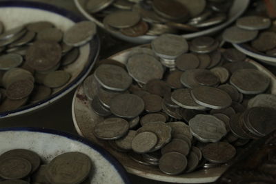 High angle view of coins on table