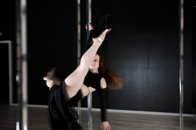 Young woman exercising in gym