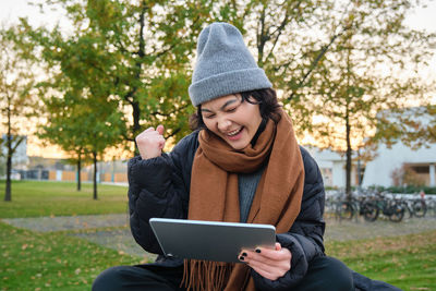 Young woman using digital tablet