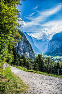 Scenic view of mountains against blue sky