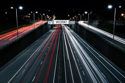 High angle view of light trails on road at night