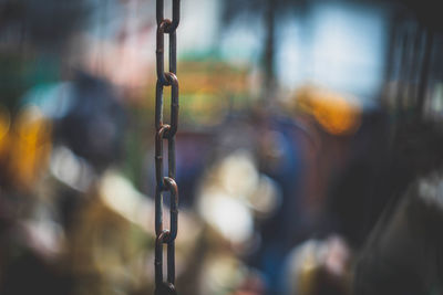 Close-up of metal chain against blurred background