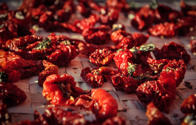 Close-up of red chili peppers on table