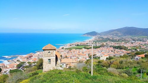 Scenic view of sea and buildings against sky