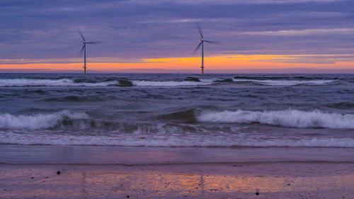 Scenic view of sea against sky during sunset