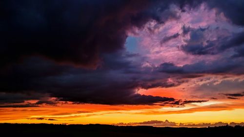 Scenic view of dramatic sky during sunset