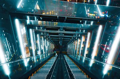 Low angle view of illuminated subway station
