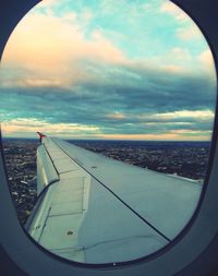 Cropped image of airplane over sea