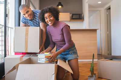 Happy woman standing at home