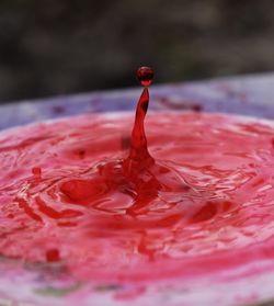 Close-up of water splashing in glass