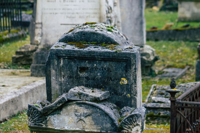 Close-up of old metal structure in cemetery