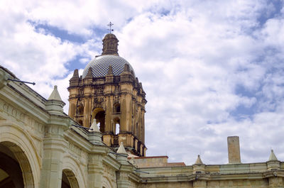 Low angle view of cathedral against cloudy sky