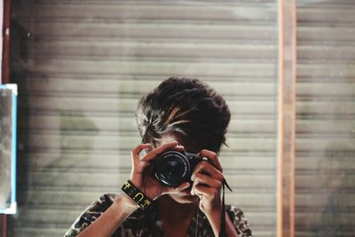 Close-up of woman photographing