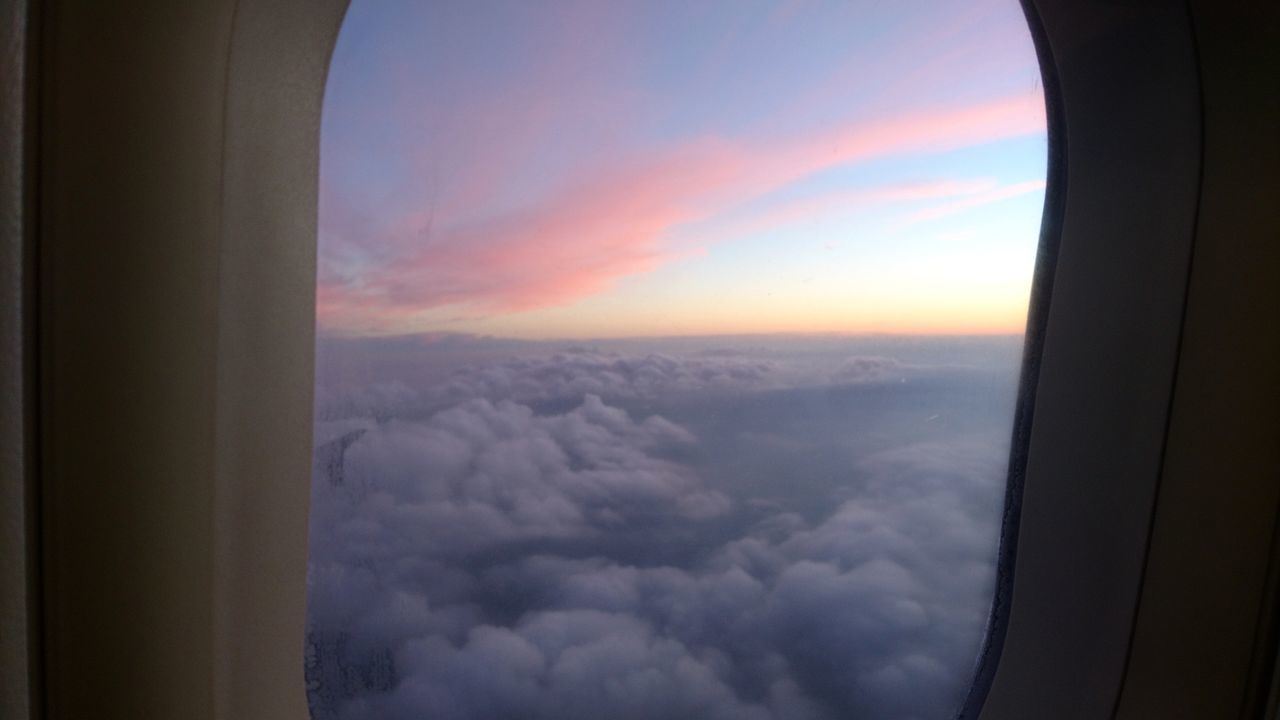 AERIAL VIEW OF SKY SEEN THROUGH AIRPLANE WINDOW