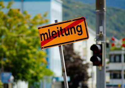 Close-up of road sign on street