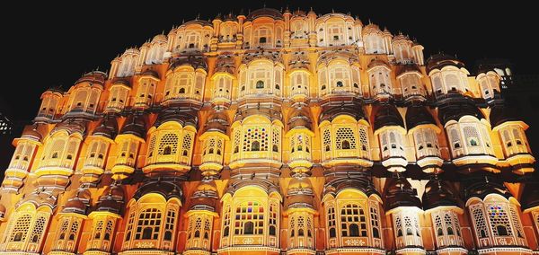 Low angle view of illuminated building at night