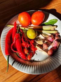 High angle view of fruits in plate on table