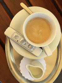 High angle view of coffee cup on table