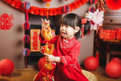 Cute girl standing in traditional clothing