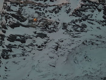 High angle view of snow on shore against sky