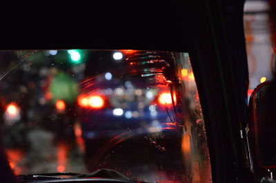 Close-up of car on road at night