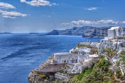 Panoramic view of sea and buildings against sky