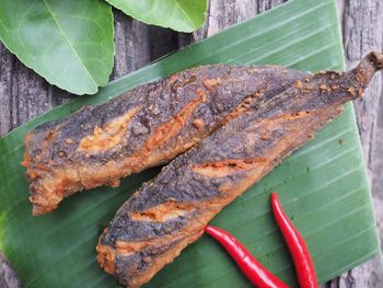 High angle view of leaves on barbecue grill