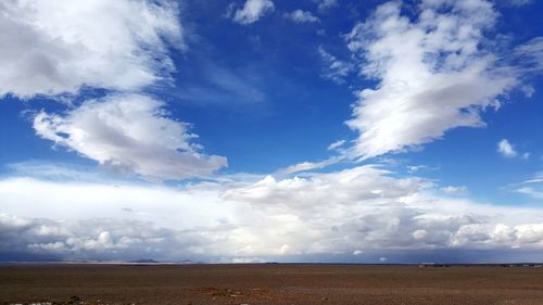 Scenic view of land against sky