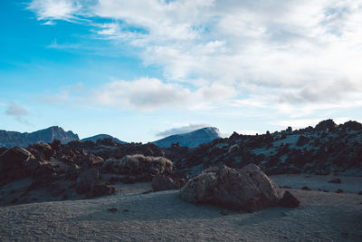 Rock formations on landscape against sky