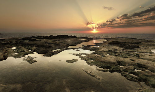 Scenic view of sea against sky during sunset