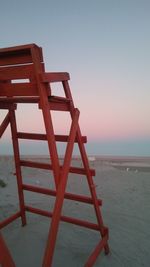 Lifeguard hut on beach against clear sky