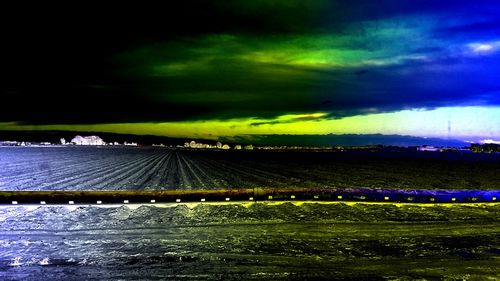 Scenic view of field against sky at night