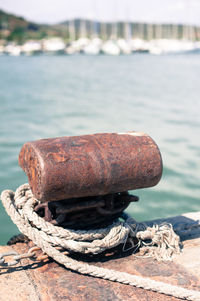 Close-up of rope tied on pier